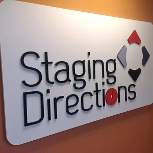 3d letter signage on a white sign plate on a interior office wall