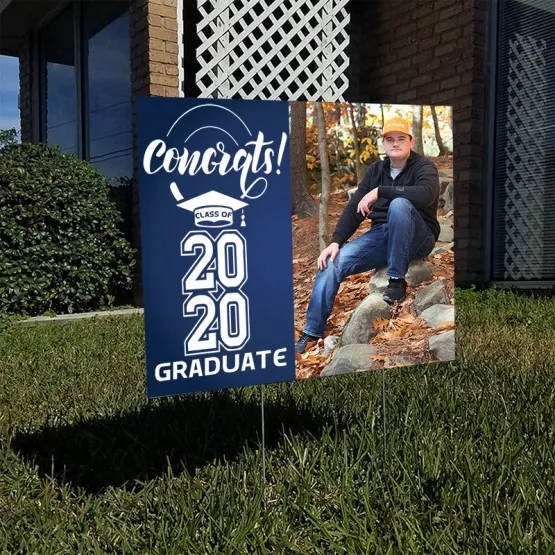 Coroplast sign that says congrats class of 2020 graduate installed on a lawn.